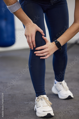 Woman, fitness legs and knee pain in gym for wellness injury, exercise training and medical accident. Athlete workout, joint pain and cardio sports emergency, bone arthritis or body muscle tension