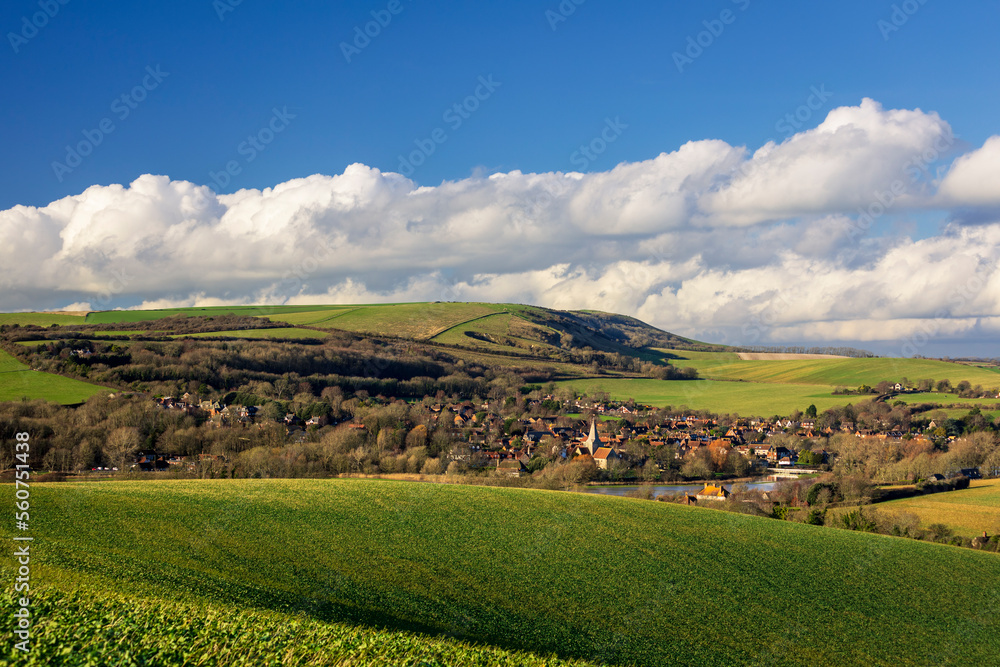 Naklejka premium Alfriston village and church nestled in the south downs hills and countryside east Sussex south east England