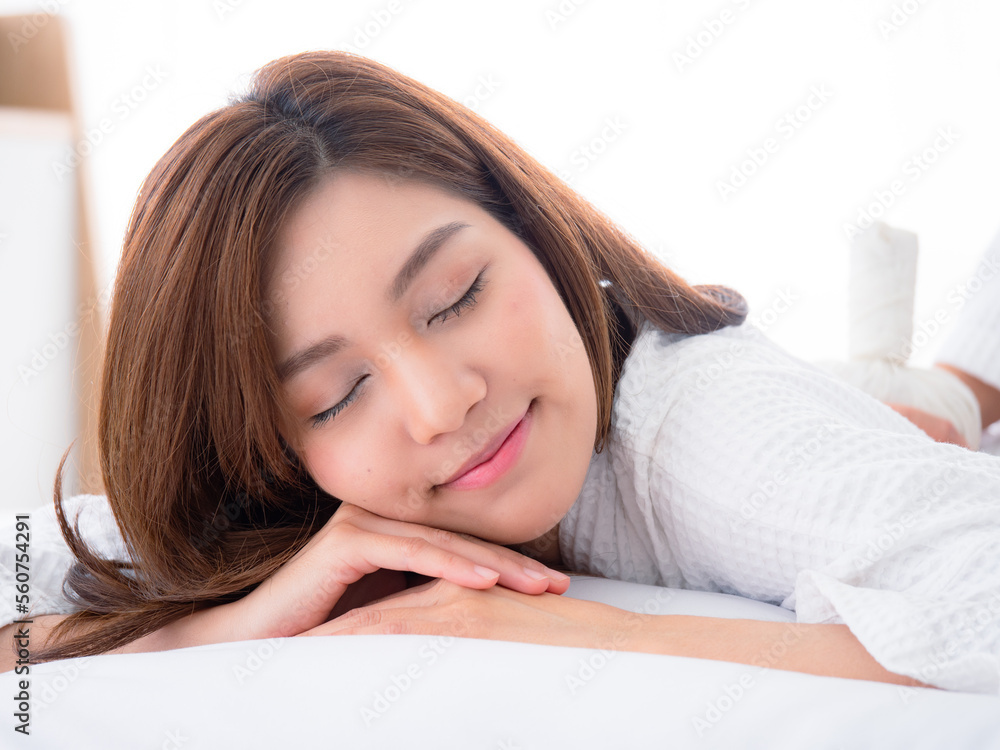 Beautiful young woman relaxing with closed eyes, waiting for massage in the home spa Beautiful young woman relaxing with closed eyes, waiting for massage in the home spa