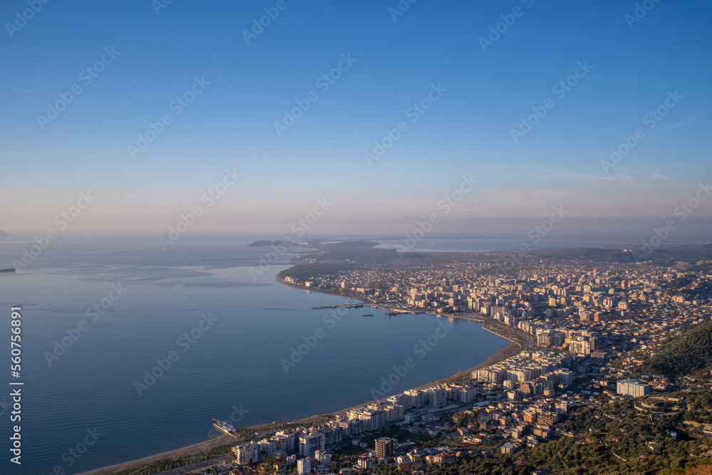 Attractive spring cityscape of Vlore city from Kanines fortress. Captivating morning sescape of Adriatic sea. Spectacular outdoor scene of Albania, Europe. Traveling concept background. Attractive spring cityscape of Vlore city from Kanines fortress. Captivating morning sescape of Adriatic sea. Spectacular outdoor scene of Albania, Europe. Traveling concept background.