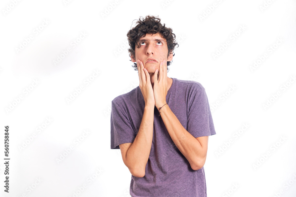 Young Hispanic man with fed up gesture. Isolated on white background. Young Hispanic man with fed up gesture. Isolated on white background.