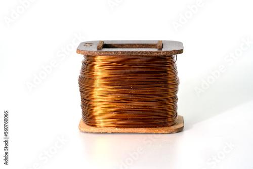 Coil of copper wire isolated on white background photo