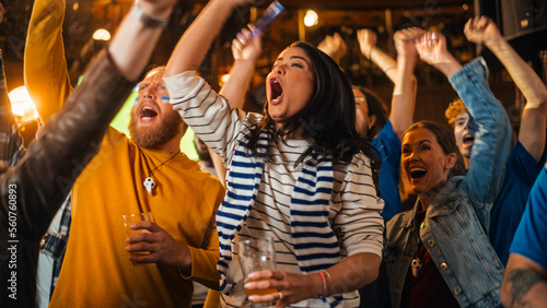 Soccer Club Members Cheering for Their Team, Playing in an International Cup Final. Supportive Fans Standing in a Bar, Cheering, Raising Hands and Shouting. Friends Celebrate Victory After the Goal.