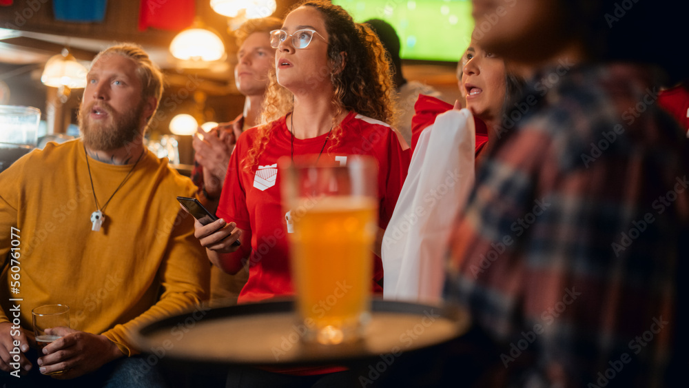Excited Female Holding a Smartphone, Nervous About the Sports Bet She Put on a Her Favorite Soccer Team. Ecstatic Emotions When Football Team Scores a Goal and She Wins a High Stakes Lottery Prize. Excited Female Holding a Smartphone, Nervous About the Sports Bet She Put on a Her Favorite Soccer Team. Ecstatic Emotions When Football Team Scores a Goal and She Wins a High Stakes Lottery Prize.