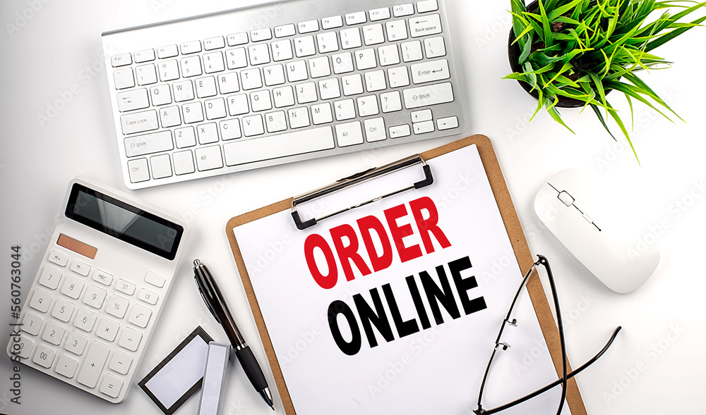 ORDER ONLINE text on white paper. the inscription on the notebook ORDER ONLINE text on white paper. the inscription on the notebook