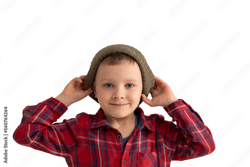 cute boy 6 years old puts a hat on his head isolated on a white background cute boy 6 years old puts a hat on his head isolated on a white background