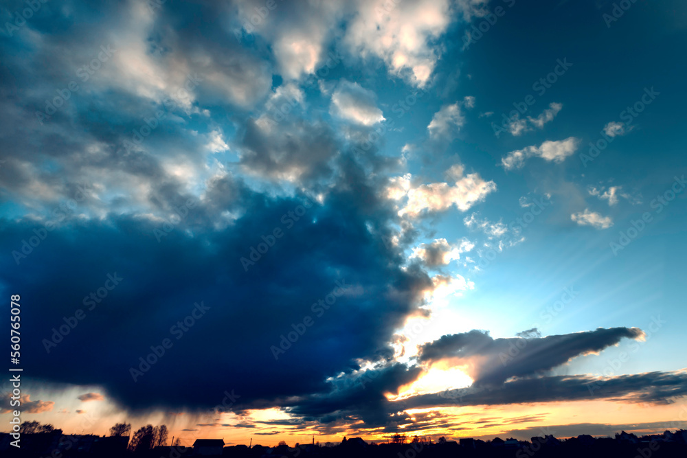 Twilight sky background with dramatic sky with rain over the city . Dramatic sky on the summer sunset. Twilight sky background with dramatic sky with rain over the city . Dramatic sky on the summer sunset.