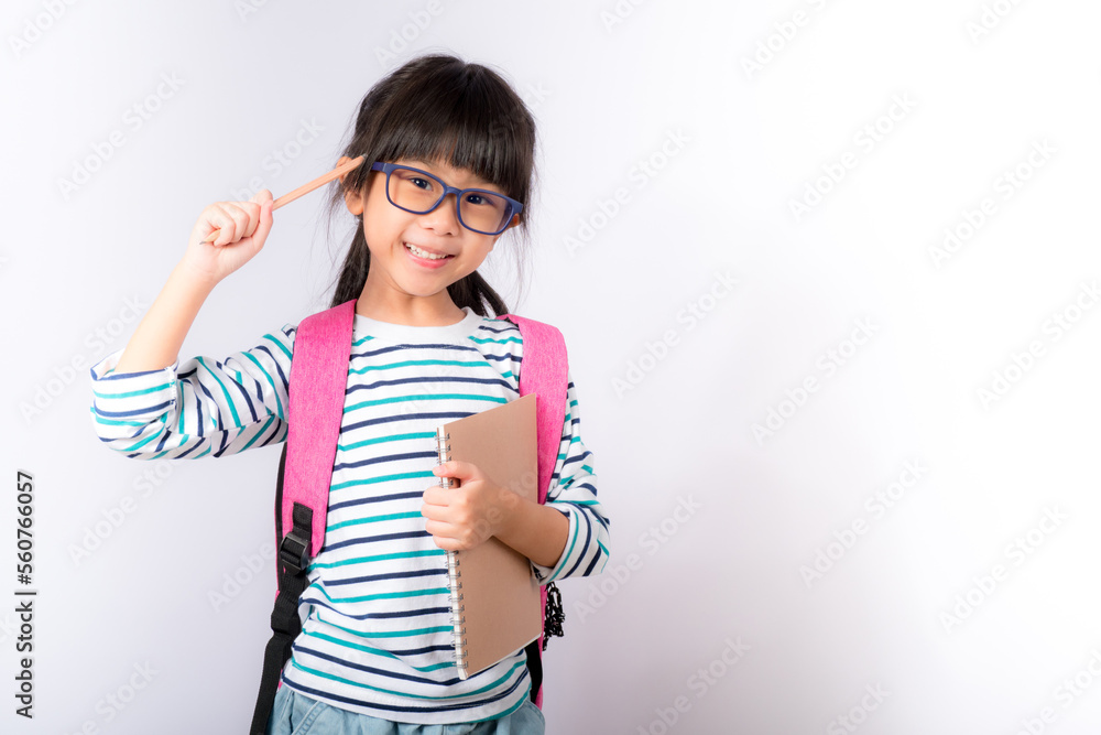 girl on white background, backpack, holding notebook, getting ready to go to school girl on white background, backpack, holding notebook, getting ready to go to school