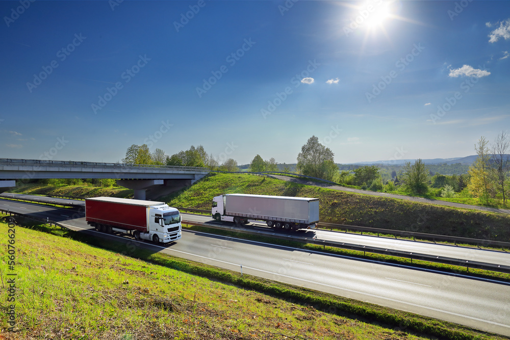 Truck transport on the road at sunset and cargo