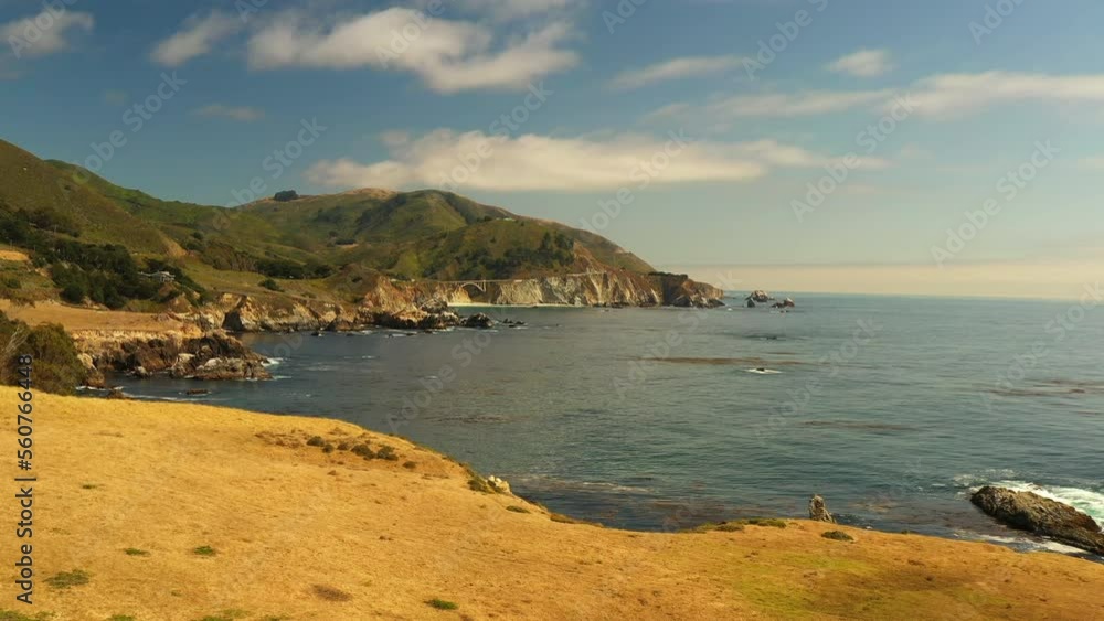 Aerial Shot Of Bixby Creek Bridge On Rock Formations, Drone Flying Forward Over Sea During Sunny Day - San Francisco, California Aerial Shot Of Bixby Creek Bridge On Rock Formations, Drone Flying Forward Over Sea During Sunny Day - San Francisco, California