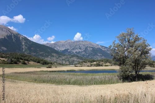 Beautiful panoramic view over Lake 'Lac du Siguret' This water is a remnant of the last glacial area that is 6000 years old. French alpine landscape in the Hautes-Alpes.