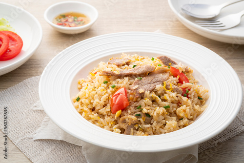 Pork Fried Rice with egg and tomato in white plate.asian food
