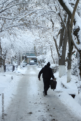 person walking in the snow 