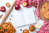 blank opened cooking book mockup with apple pie, meat pie and seasonal fruit