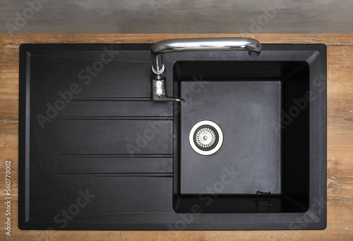 New granite kitchen sink black wash flat lay. After. House cleaning service. Top view