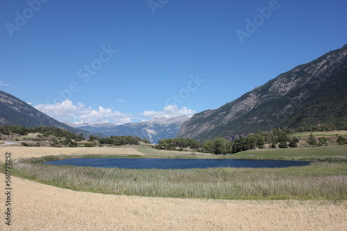 Beautiful panoramic view over Lake 'Lac du Siguret' This water is a remnant of the last glacial area that is 6000 years old. French alpine landscape in the Hautes-Alpes. photo