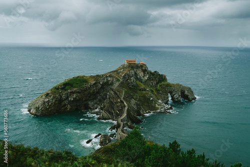 View of the islet of Gaztelugatxe, Basque Country, connected to the mainland by a man-made bridge photo