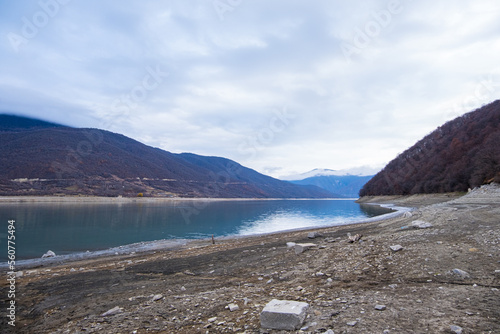 Ananuri, Georgia : 20-11-2022 : Landscape of  Aragvi River next to the  Ananuri castle complex, close Tblisi, Georgia, . It is a dry river in  a cloudy day in winter photo