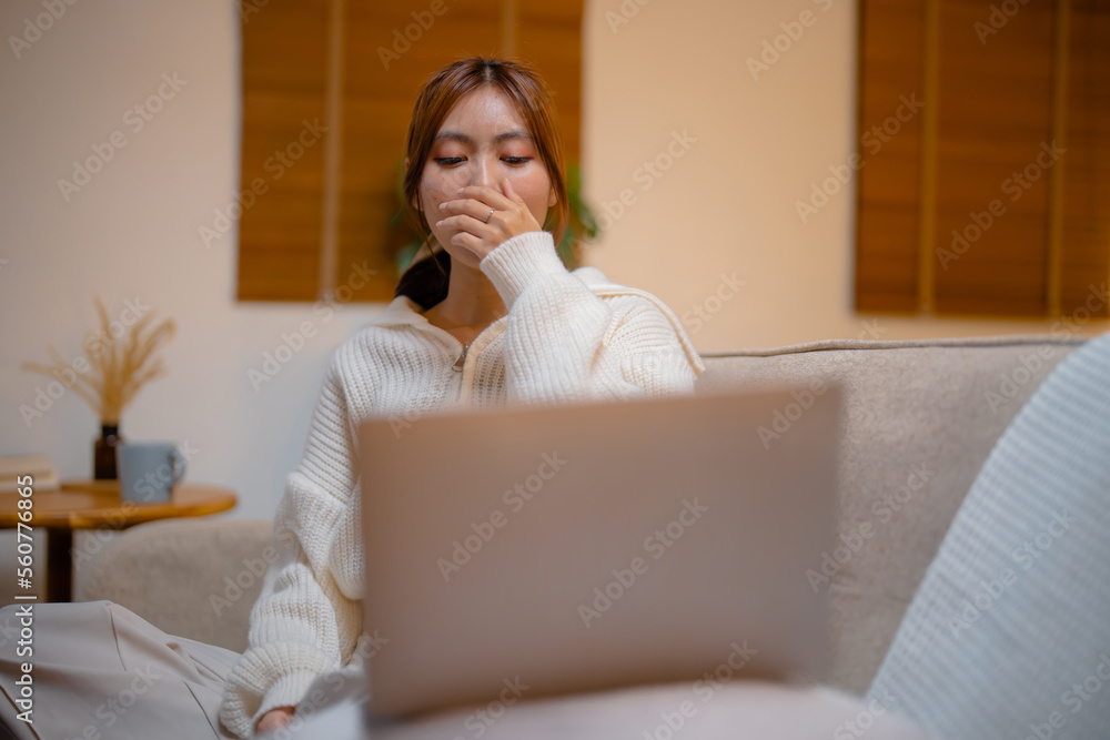 Asian woman overworking from home at night..overtime tired late night Asian woman overworking from home at night..overtime tired late night