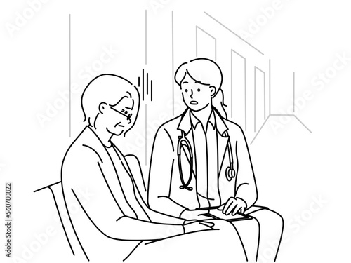 Female doctor talk with mature patient in clinic 