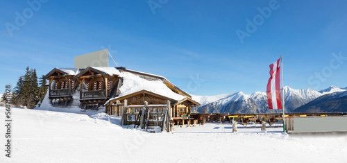 Sunny view of a ski hut in the Alps, Austria, Salzburg #560781028