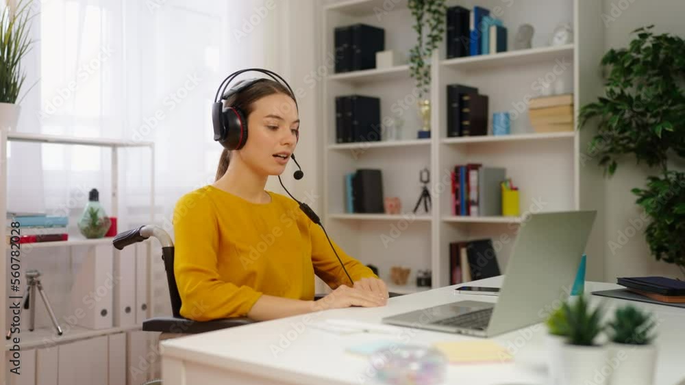 Young woman with physical disability working as a call operator from home Young woman with physical disability working as a call operator from home