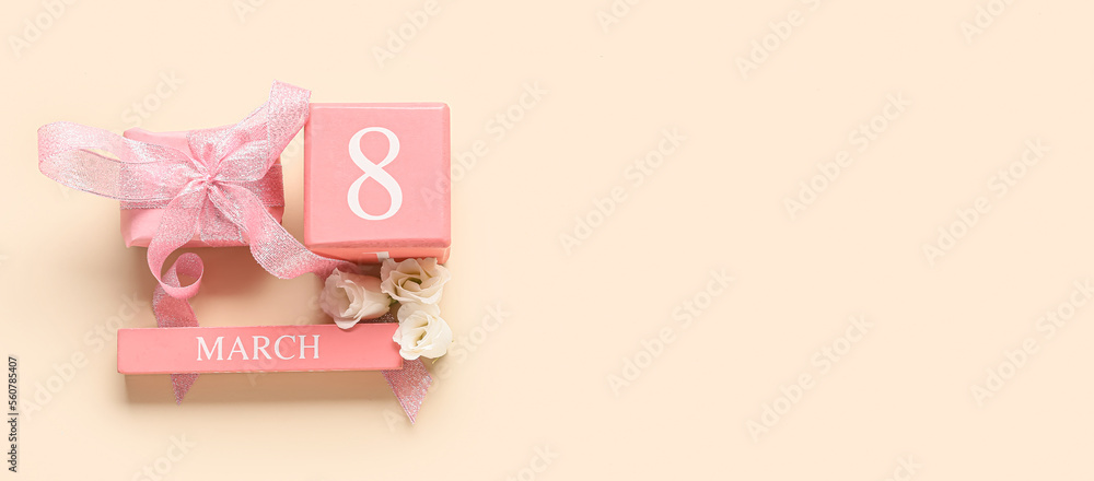 Calendar with date of International Women's Day, gift and flowers on light background with space for text