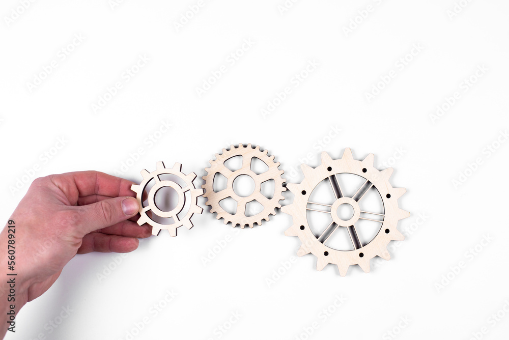 Gears. Gear wheel. Mechanisms are interconnected by themselves. On a white background. The concept of dependence on each other. Gears. Gear wheel. Mechanisms are interconnected by themselves. On a white background. The concept of dependence on each other.