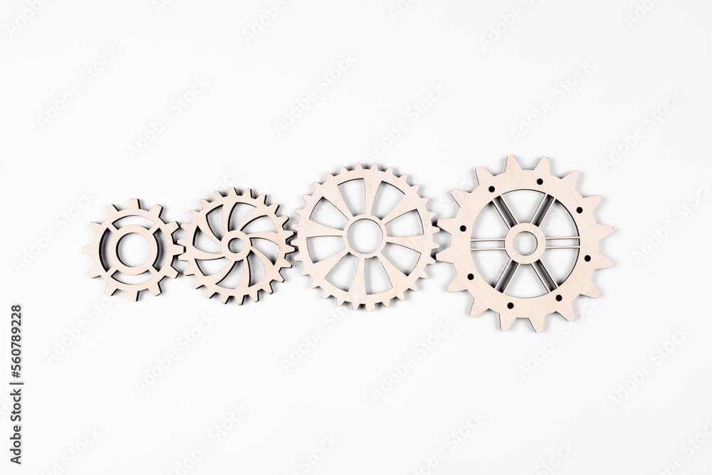 Gears. Gear wheel. Mechanisms are interconnected by themselves. On a white background. The concept of dependence on each other.