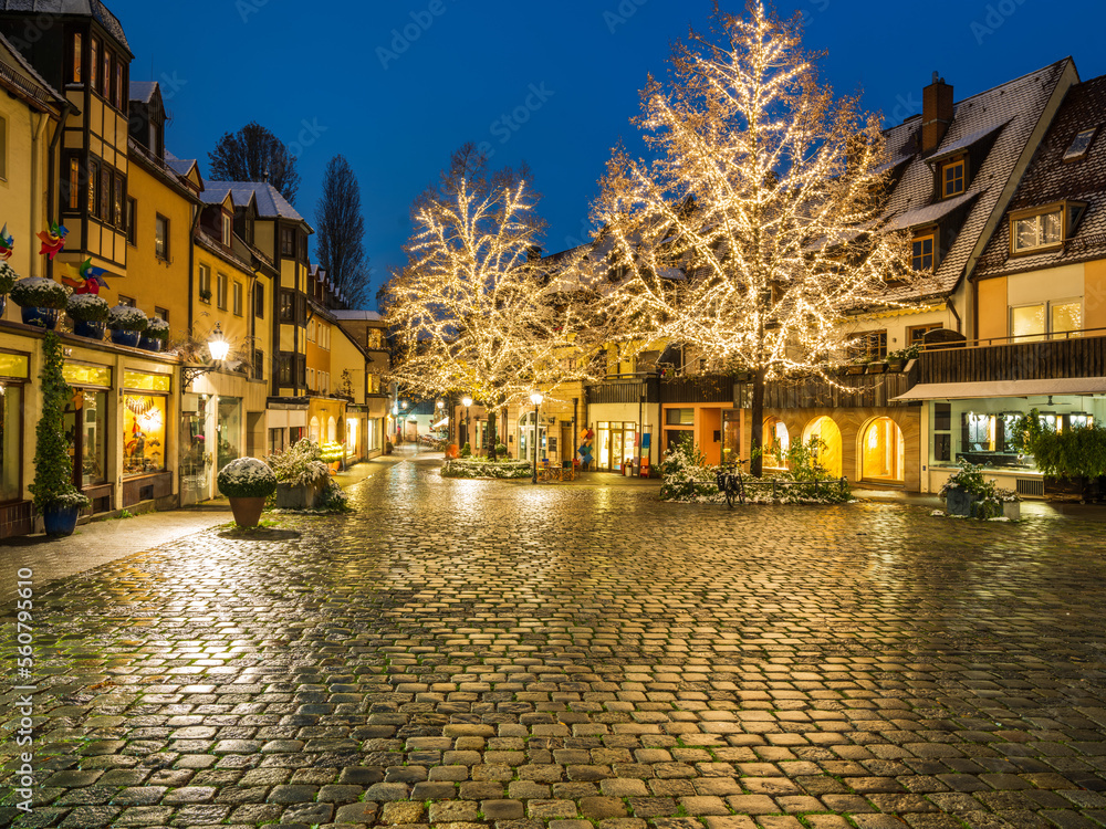 Nuremberg Christmas lights  illuminating cobblestone and the whole street at night, Germany