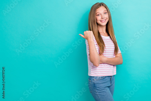 Portrait of lovely cheerful person toothy smile direct thumb finger empty space isolated on aquamarine color background