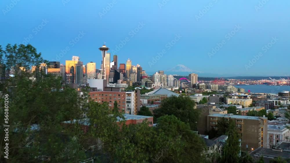 Aerial Forward Shot Of Trees With Houses And Buildings In City Against Blue Sky - Seattle, Washington Aerial Forward Shot Of Trees With Houses And Buildings In City Against Blue Sky - Seattle, Washington