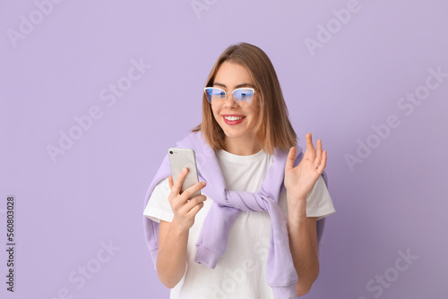 Young woman in eyeglasses u...