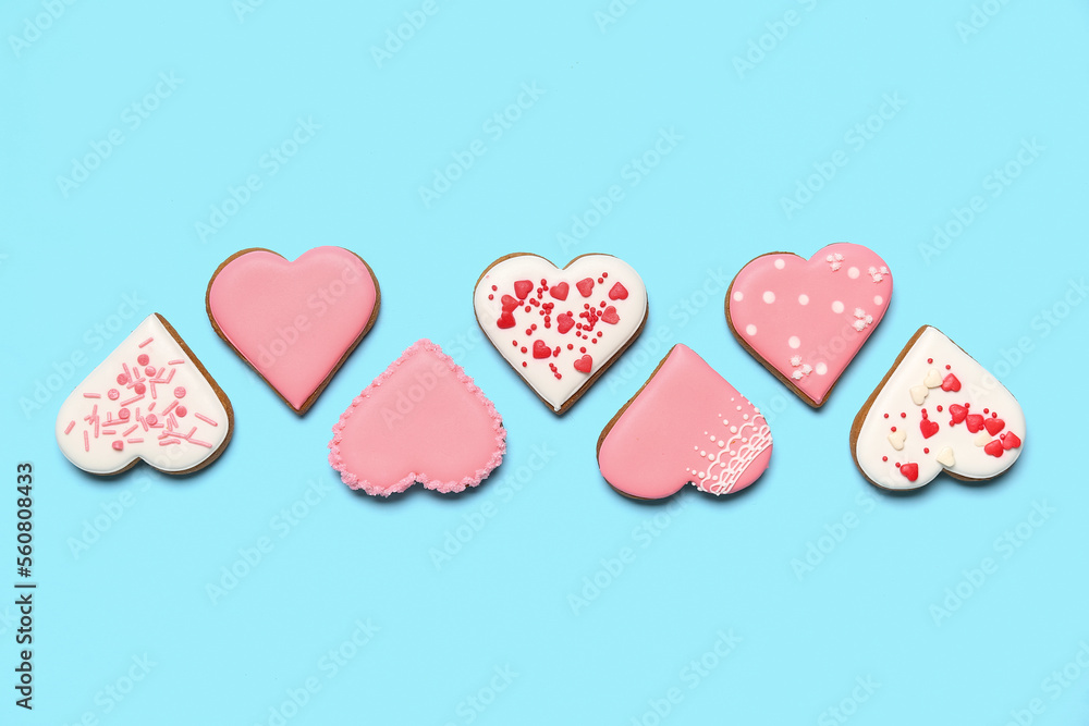 Composition with delicious heart shaped cookies on color background. Valentine's Day celebration Composition with delicious heart shaped cookies on color background. Valentine's Day celebration