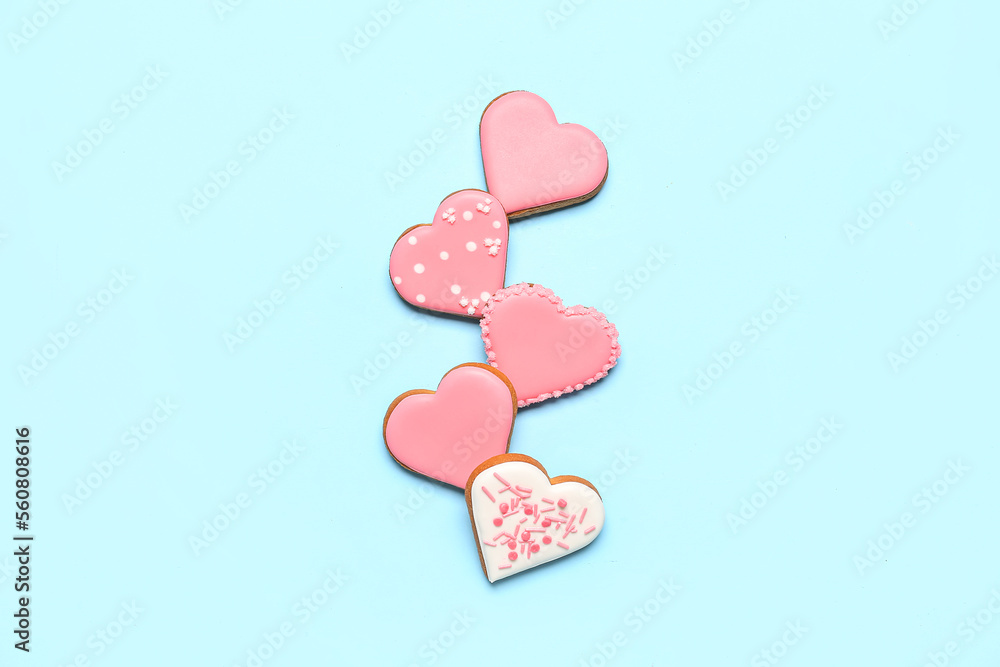 Fototapeta premium Composition with sweet heart shaped cookies on color background. Valentine's Day celebration