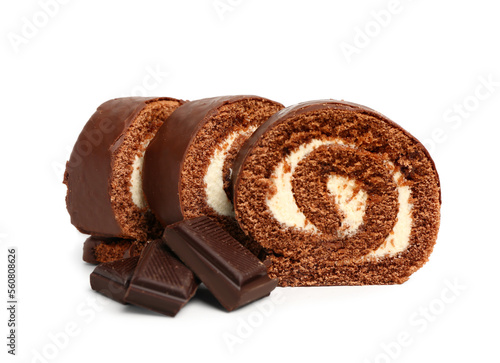 Fototapeta Pieces of tasty sponge cake roll and chocolate on white background