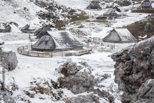 Velika planina mountain 1666 m in Kamnik Savinja Alps in Slovenia, winter hiking in herdsmen’s huts village covered with snow photo