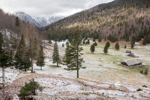 Velika planina mountain 1666 m in Kamnik Savinja Alps in Slovenia, winter hiking in herdsmen’s huts village covered with snow photo