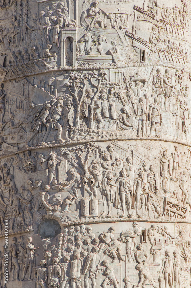 Close-up of the Trajan Column (Colonna Traiana). detail of Roman triumphal column in Rome, Italy. Close-up of the Trajan Column (Colonna Traiana). detail of Roman triumphal column in Rome, Italy.