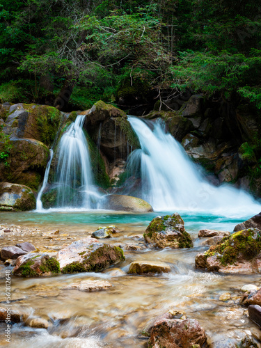 small waterfall of the Travignolo stream in Val Venegia, Pale di San Martino, Trentino, Italy photo