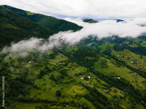 Green mountains of the Ukrainian Carpathians in the morning fog. Aerial drone view. © dvv1989