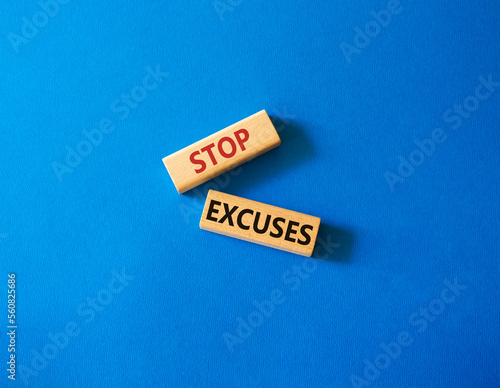 Stop excuses symbol. Concept words Stop excuses on wooden blocks. Beautiful blue background. Business and Stop excuses concept. Copy space.