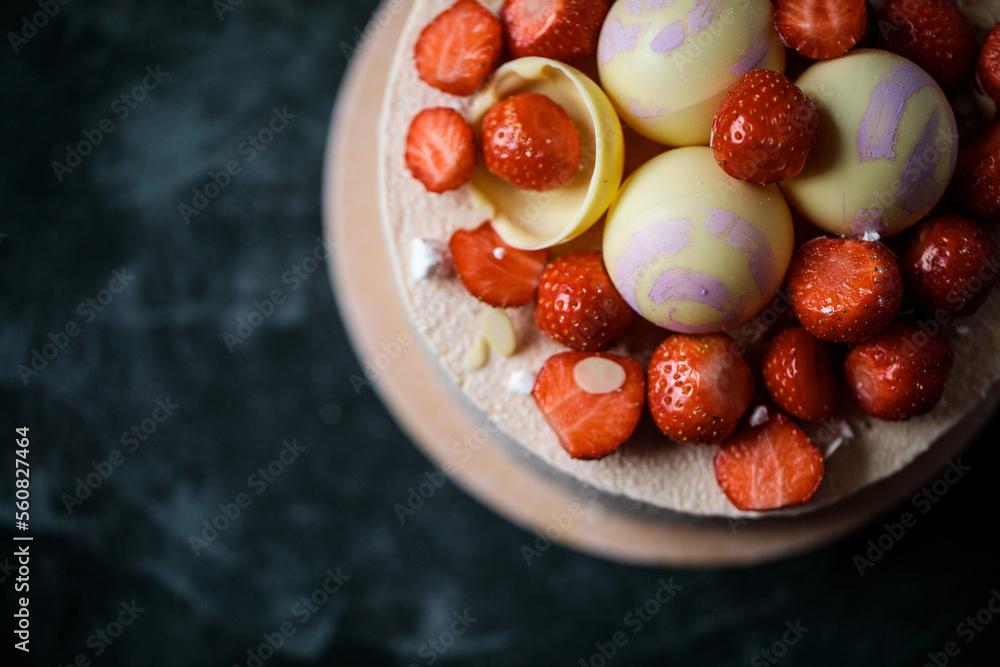 biscuit cake decorated with strawberries and chocolate balls biscuit cake decorated with strawberries and chocolate balls