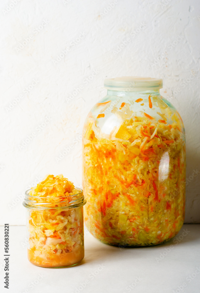 Sauerkraut, Shredded cabbage, apples, and carrots on bright rustic background, Fermented Food, Healthy Eating Sauerkraut, Shredded cabbage, apples, and carrots on bright rustic background, Fermented Food, Healthy Eating