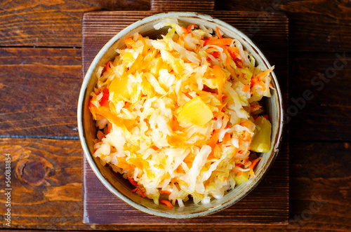 Sauerkraut  Shredded cabbage  apples  and carrots on dark rustic background  Fermented Food  Healthy Eating