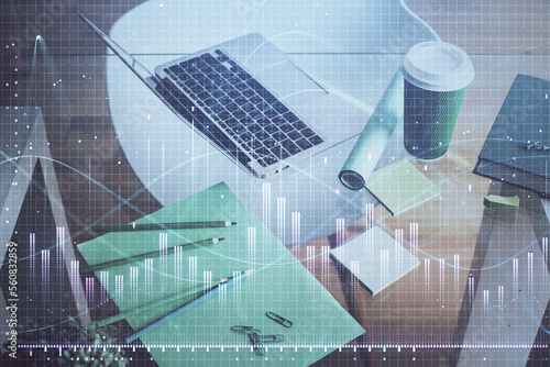 Financial graph colorful drawing and table with computer on background. Double exposure. Concept of international markets.