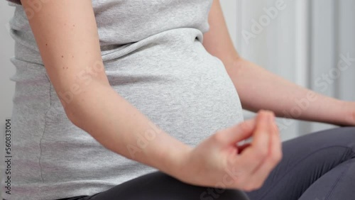 Wallpaper Mural Pregnant woman meditates sitting in lotus position in own apartment. Gravid lady takes care of wellbeing and upcoming baby health and unites with internal world Torontodigital.ca
