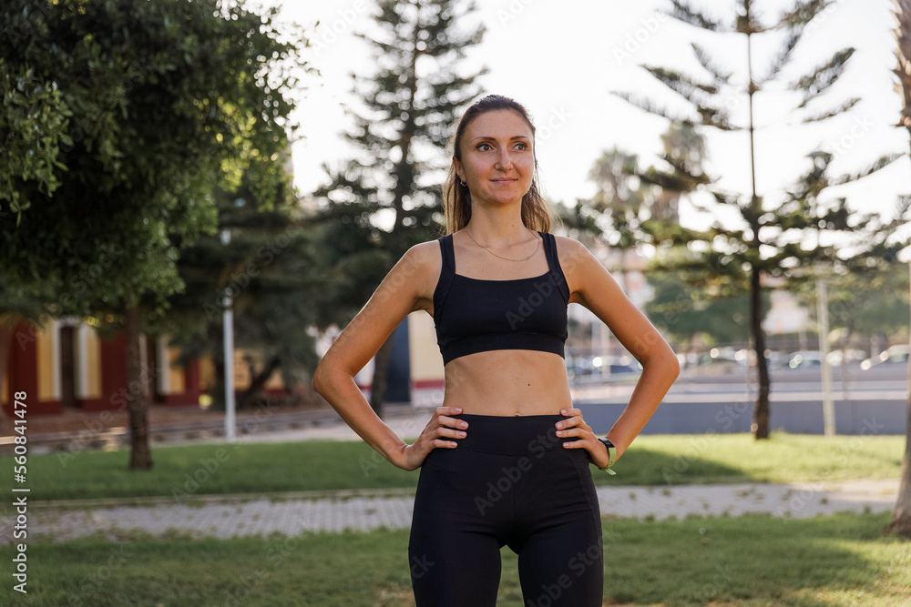 Pretty woman doing yoga in morning park. Healthy lifestyle outdoor conception. Sport. Woman nature portrait doing exercises. Healthy lifestyle.