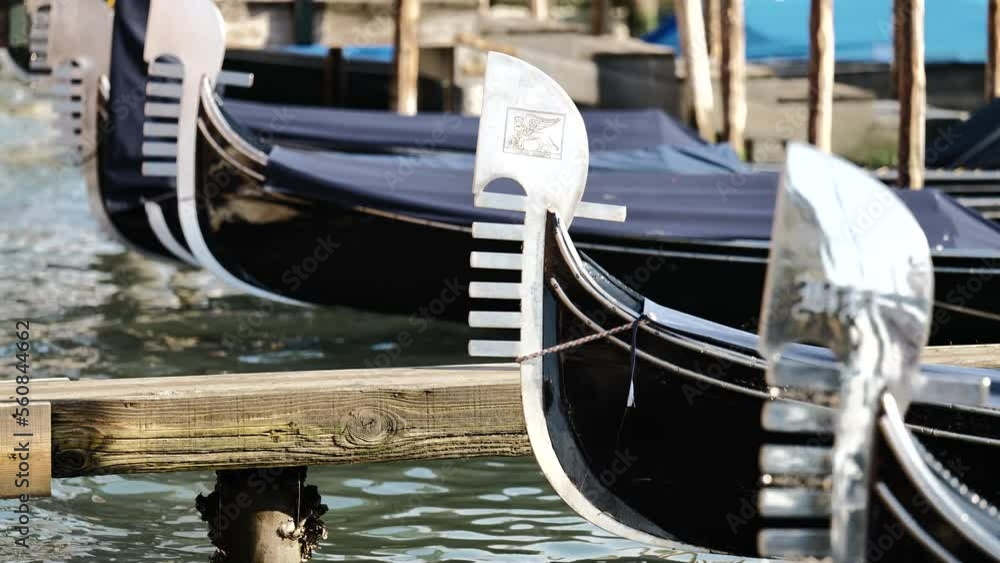 Venice, Italy - gondolas and gondoliers in the Grand Canal near the Rialto Bridge, in the San Marco Basin and between the canals of the lagoon city Venice, Italy - gondolas and gondoliers in the Grand Canal near the Rialto Bridge, in the San Marco Basin and between the canals of the lagoon city