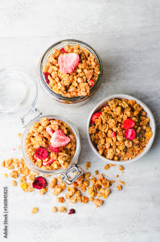 Granola with Dried Berries on Bright Concrete Background, Healthy Vegan Snack or Breakfast